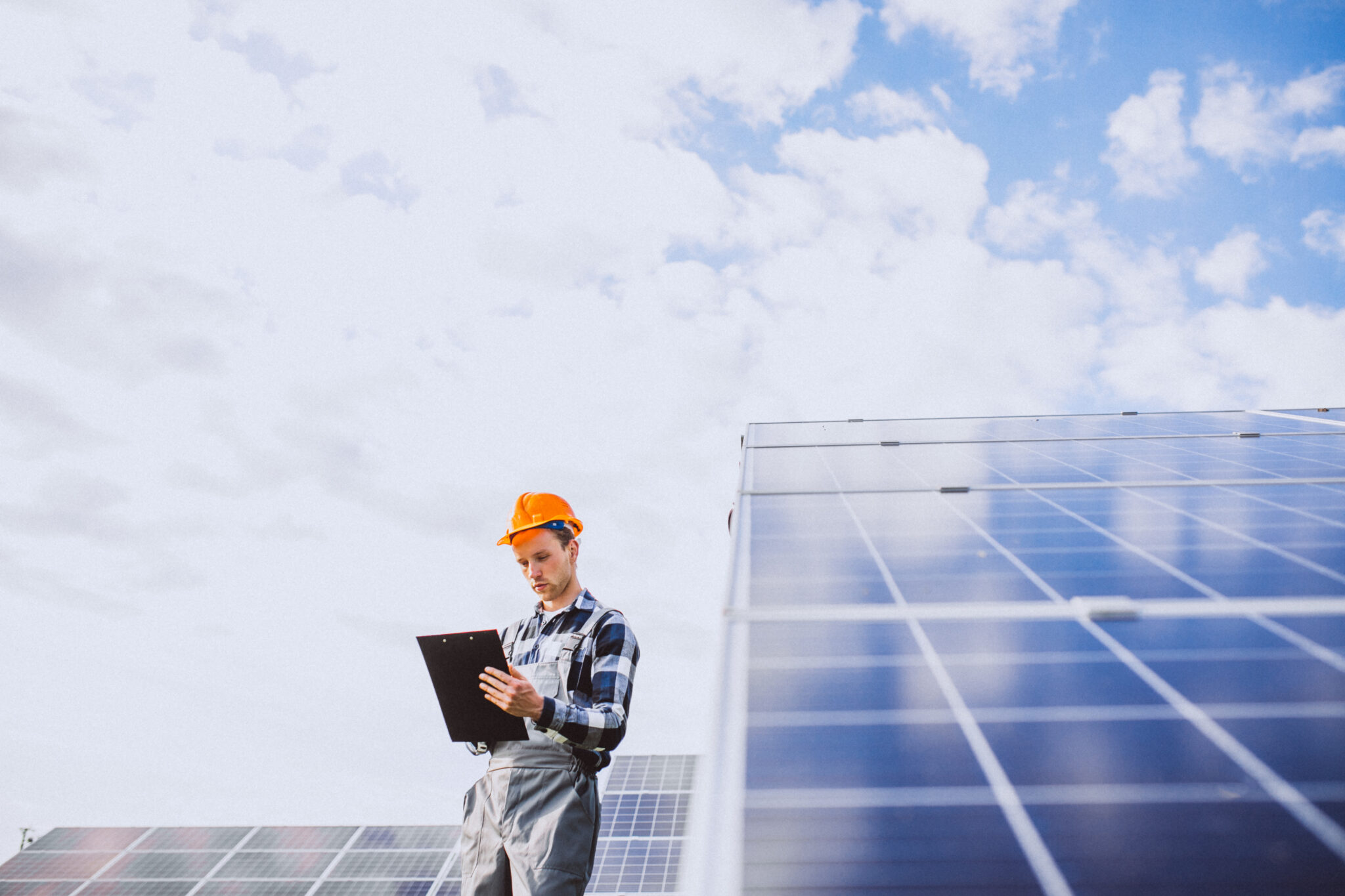 man worker firld by solar panels 1 1